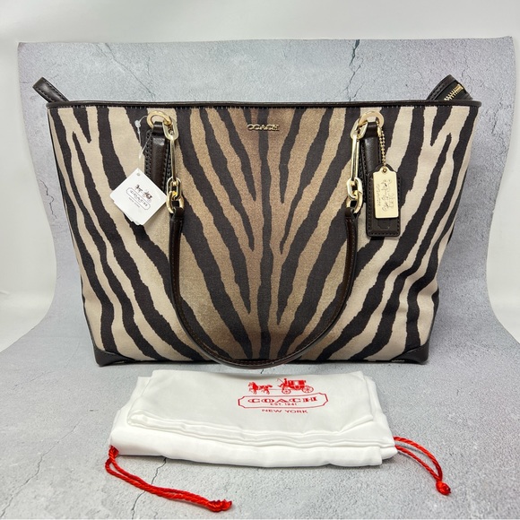 Coach Handbags - Coach NWT Madison Zebra Print East/West Tote.